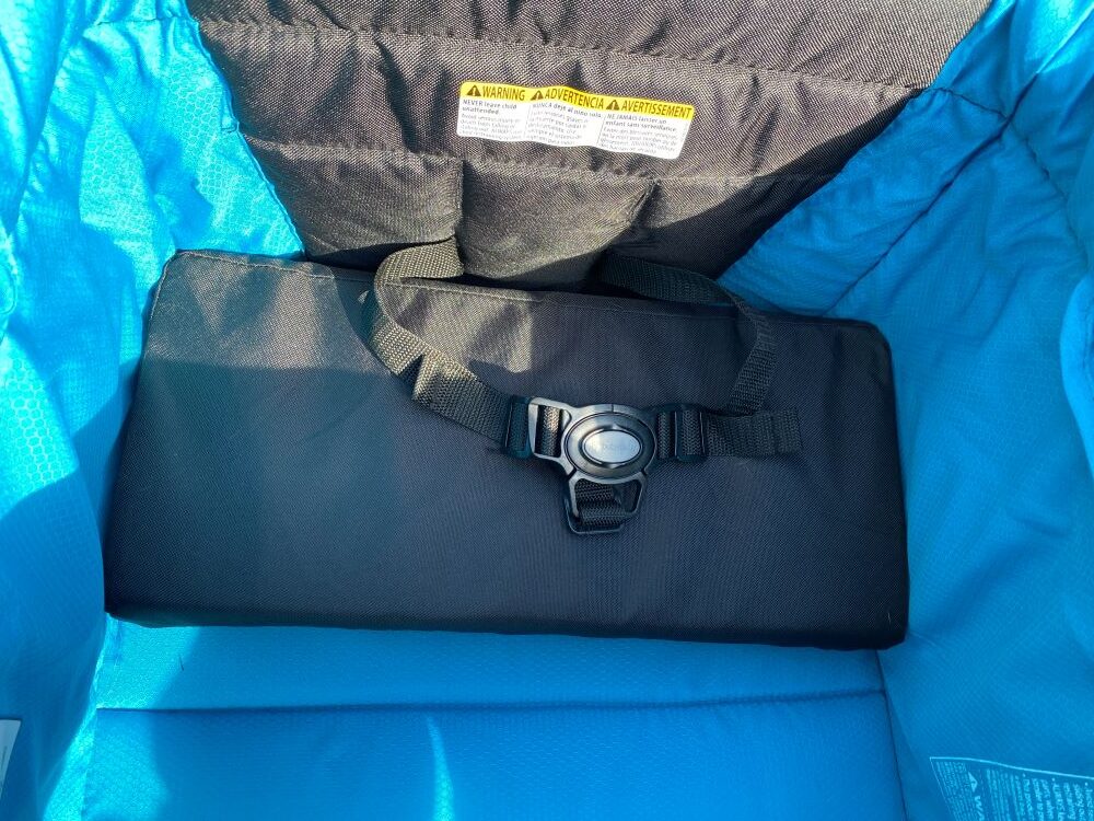 folded foam seat pad of the expedition stroller wagon and 3-point harness
