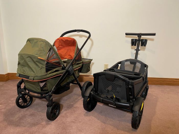 The Evenflo Pivot Xplore and Veer Cruiser stroller wagons facing forward, side by side
