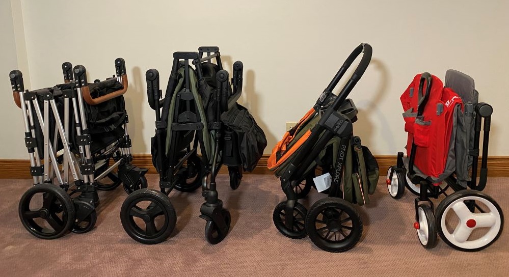 Keenz 7S, Jeep Wrangler, Evenflo Pivot Xplore, Radio Flyer Discovery stroller wagons, all folded and standing.