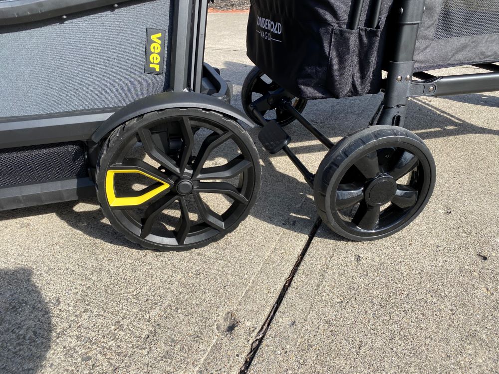 Veer Cruiser and Wonderfold W4 Elite back to back comparing wheel size. The Veer's are quite a bit wider in diameter.