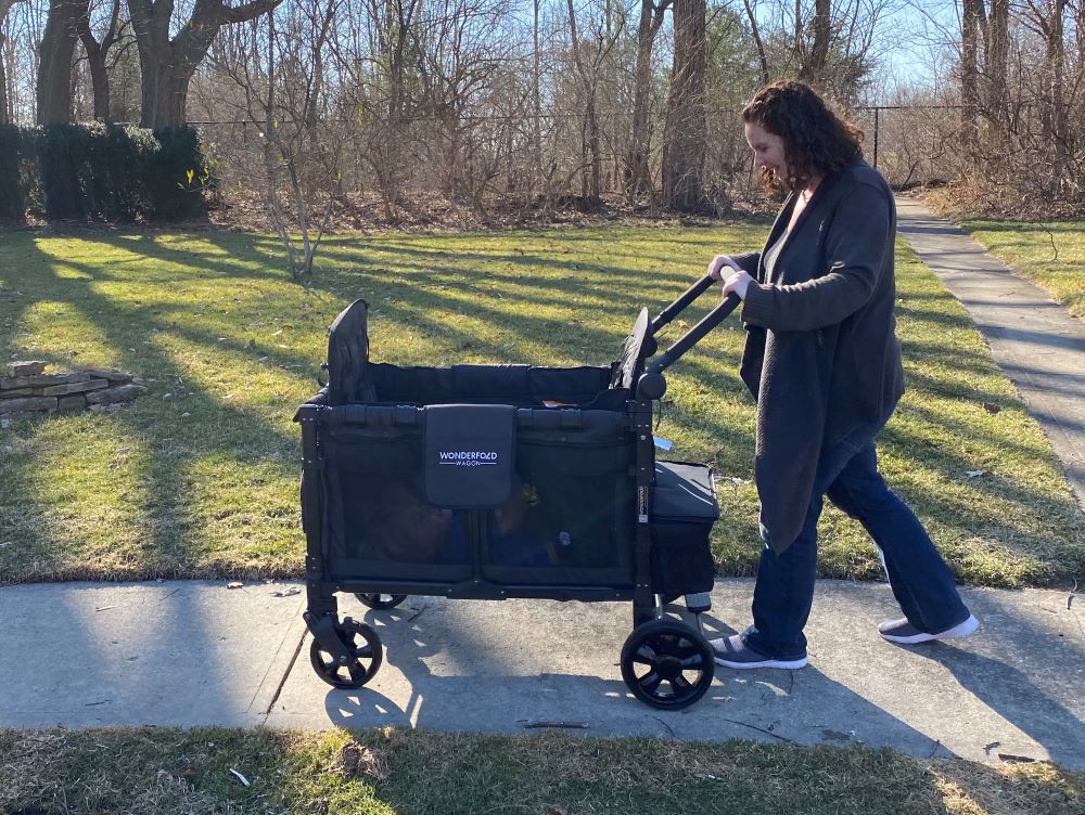 Mom pushing the wonderfold w4 elite in our outdoor testing