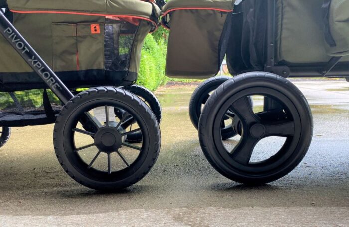Rear wheels of the Evenflo and Jeep side by side
