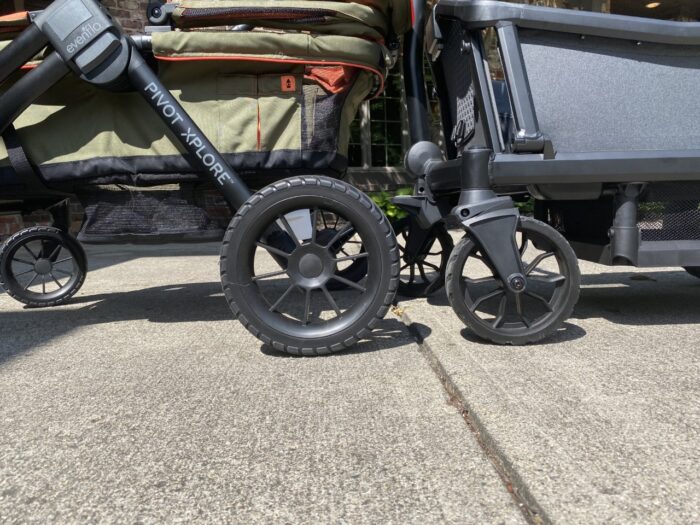 Rear wheels of the evenflo xplore on left and veer cruiser on right