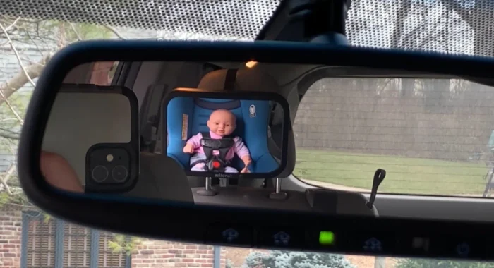 funbliss baby car mirror as seen through vehicle rearview mirror