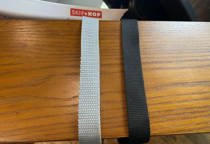 Skip Hop and Lusso straps side by side showing the finer weave of the Lusso strap