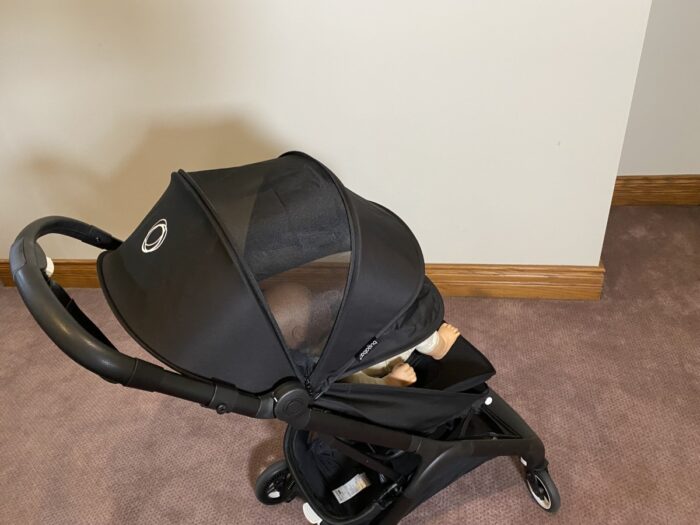 bugaboo butterfly with peekaboo mesh canopy allowing you to see the doll in the seat