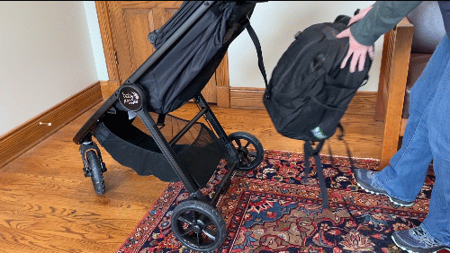 Attempting to put a full backpack in the basket of a baby jogger city mini gt2. First it won't fit in back, next it won't fit under the seat from the front. Last is able to put it in the side by pushing down the mash fabric, but with some difficulty