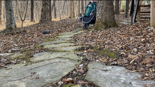 britax b-lively on a rough stone path