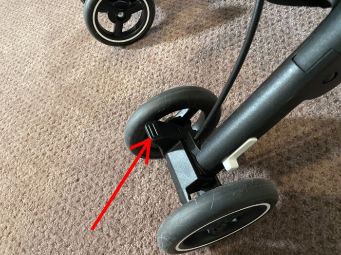 gb pockit+ brake pedal on right rear wheel with red arrow pointing to it.