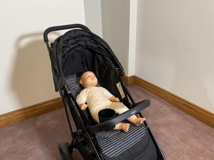 graco nimblelite with seat reclined and doll laying in the seat