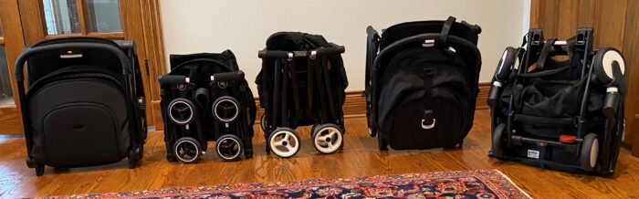 small strollers folded and standing. Left to right: Joolz Aer, gb Pockit+, Cybex Libelle, Bugaboo Butterfly, Babyzen YoYo2