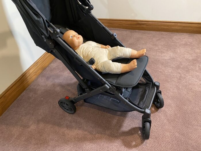 doll in minu v2 stroller fully reclined with leg rest up