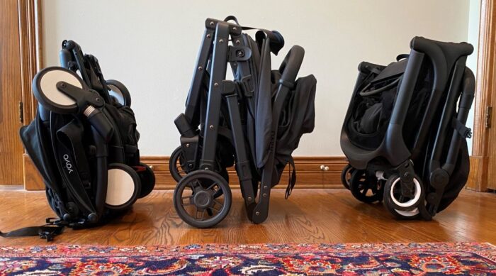 Babyzen YoYo² left, UPPAbaby MINU V2 center, Bugaboo Butterfly right. All are folded and standing.