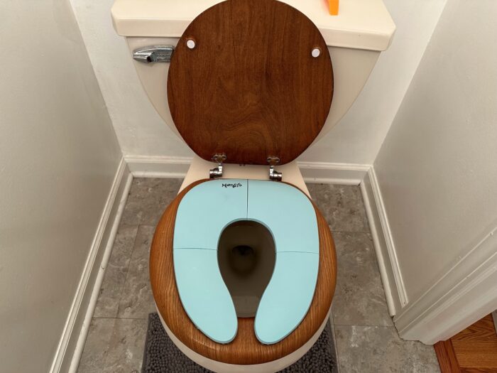 Front view of the Homsis Potty Seat installed on a toilet