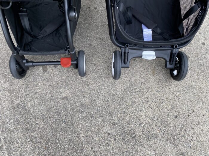 showing rear wheels and brake pedals of each stroller side by side. babyzen on left and bugaboo on right