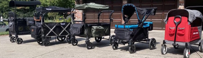 5 wagons in a row that have a traditional, boxy wagon shape