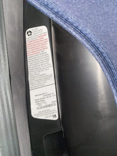 Car seat label on the side of a tall booster seat